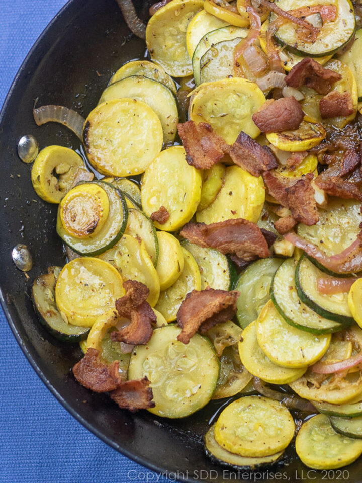 sauteed zucchini and yellow squash in a fry pan