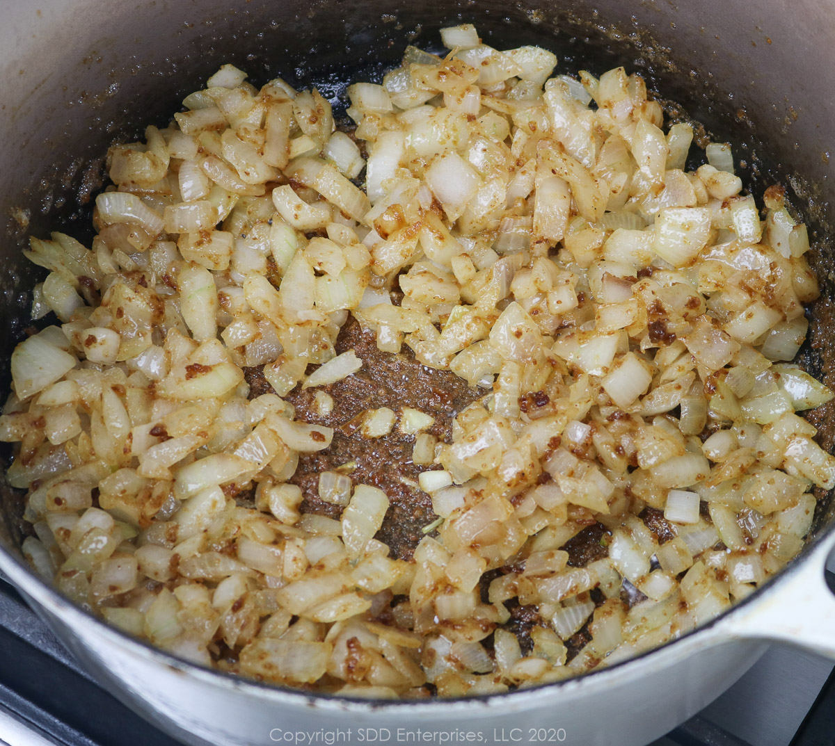 onions frying in a roux in a dutch oven