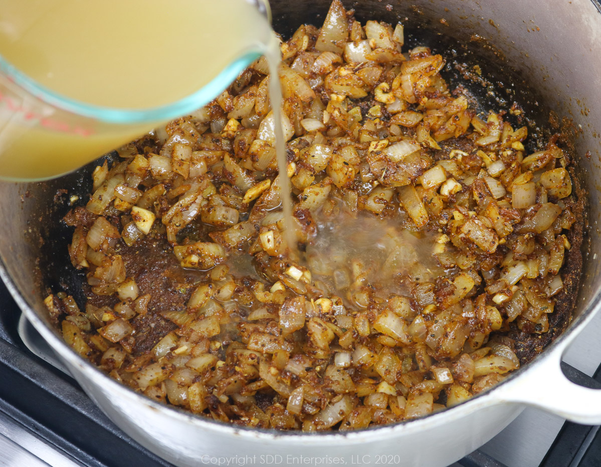 deglazing a dutch oven with chicken stock