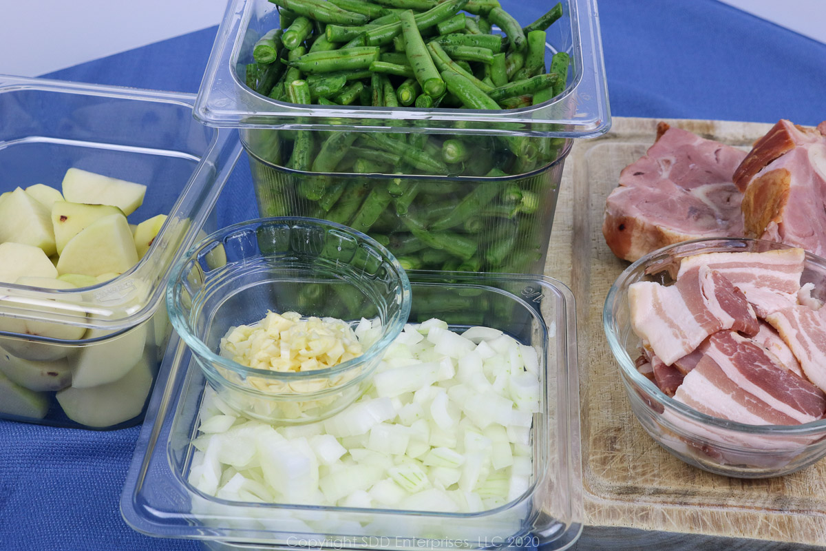 prepared ingredients for smothered green beans in prep bowls