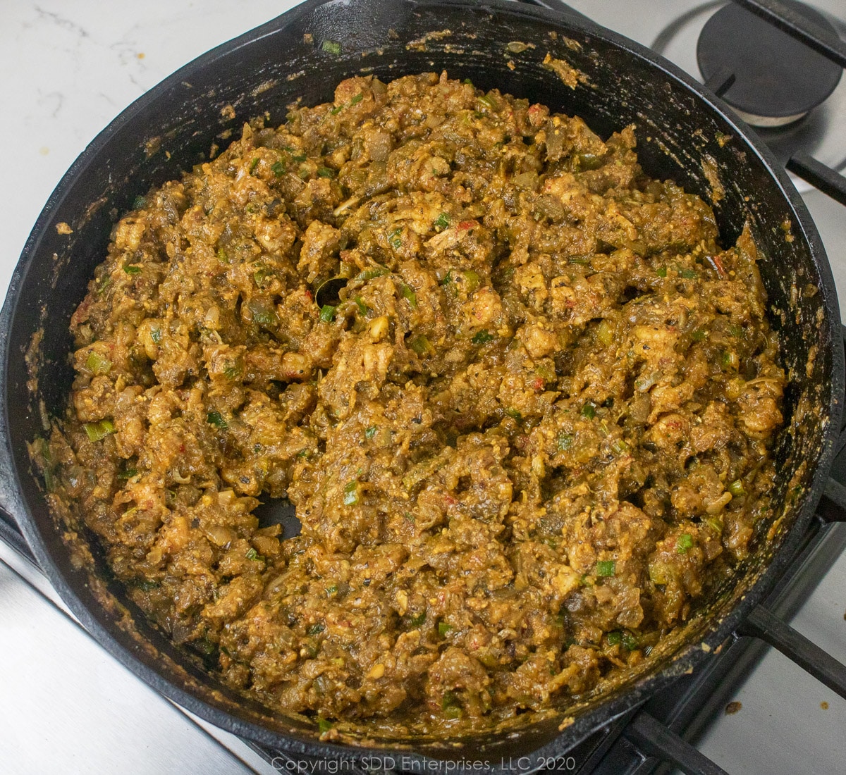 filling for crawfish eggplant rollatini in a cast iron frying pan