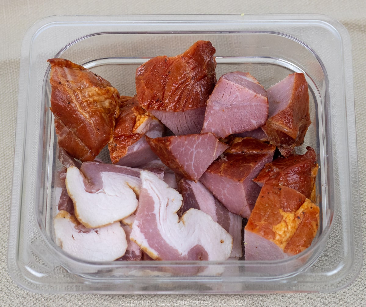 chopped tasso and smoked bacon in a prep bowl
