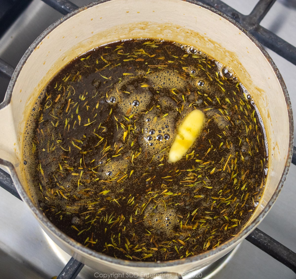 dry ingredients added to liquids in a small sauce pan for cane syrup sauce