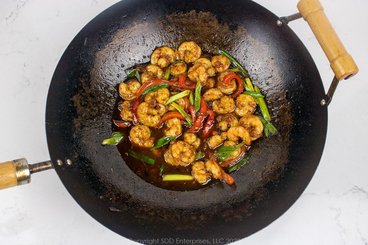 shrimp with cane syrup sauce in a wok