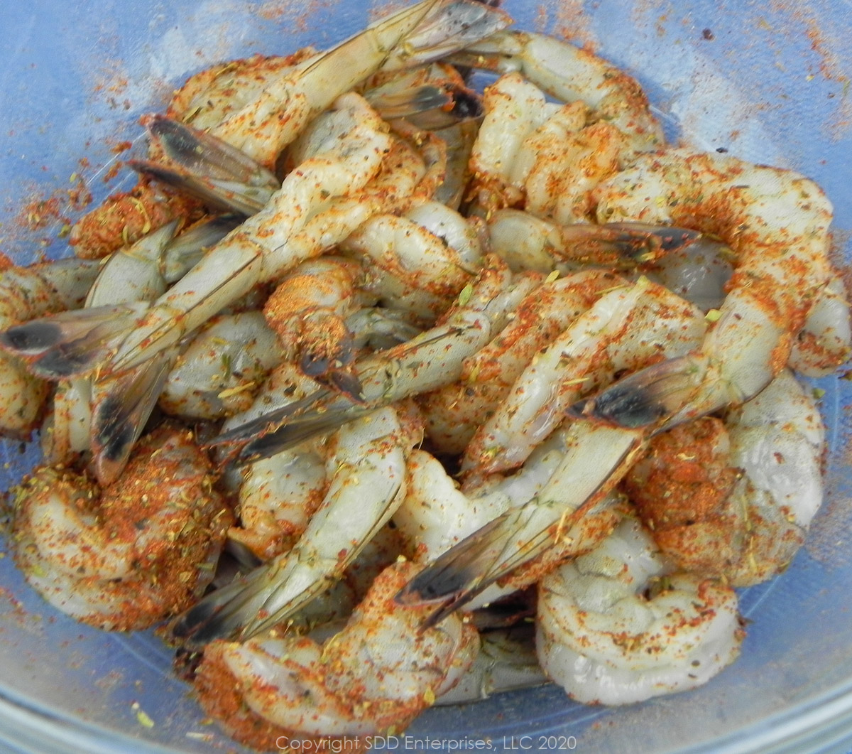 peeled shrimp with creole seasoning on a bowl