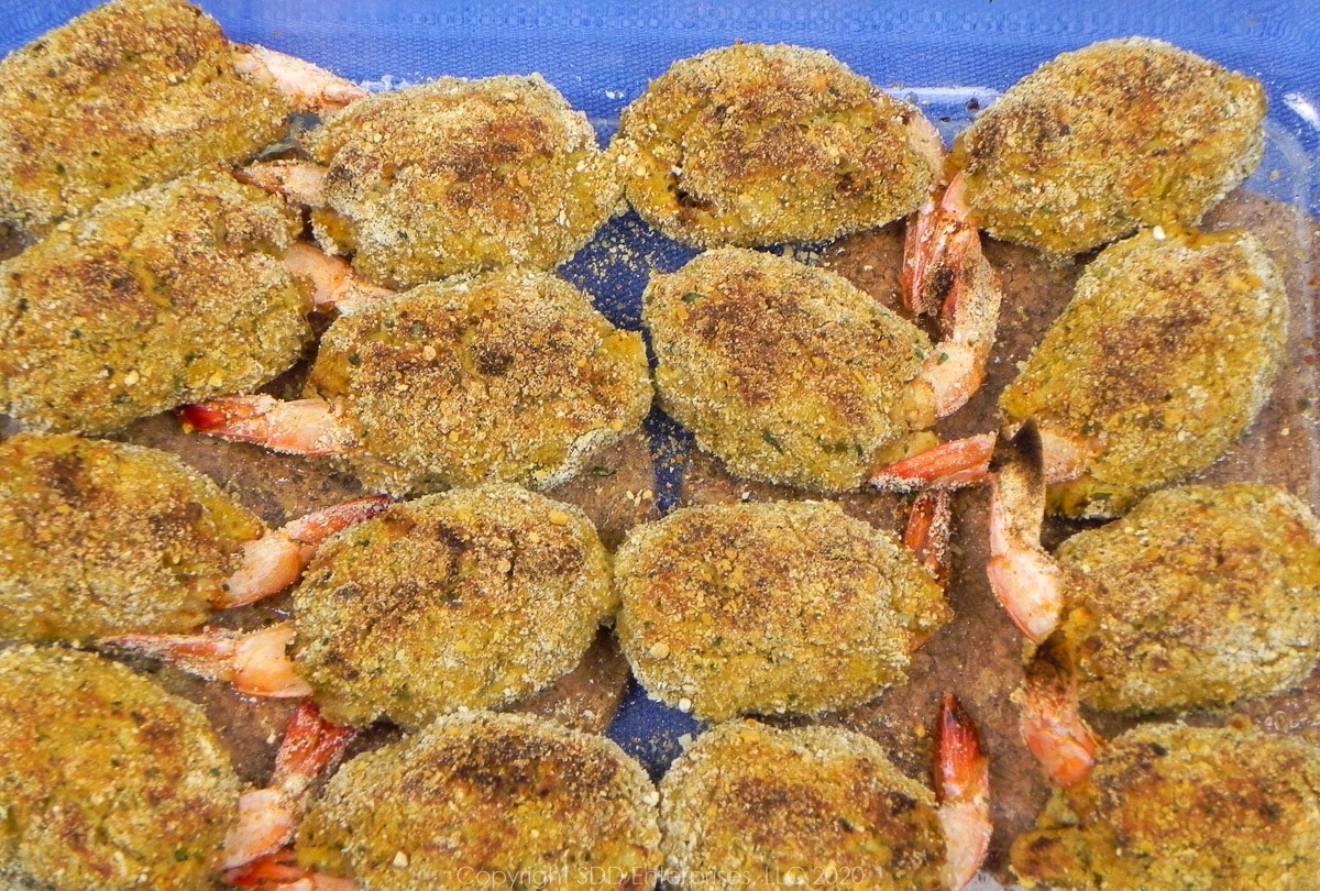 crab meat stuffed shrimp in a baking dish right out of the oven