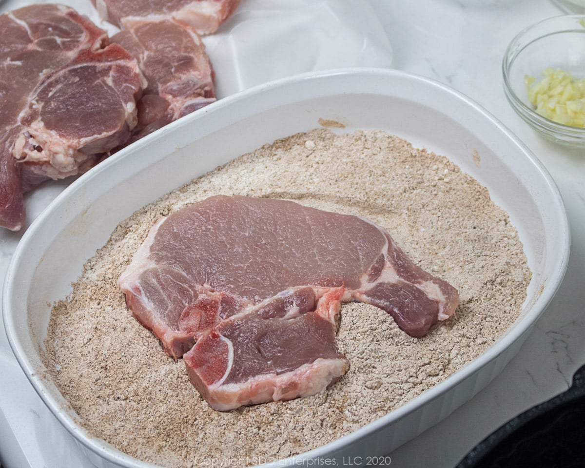 bone-in pork chop in flour dredge