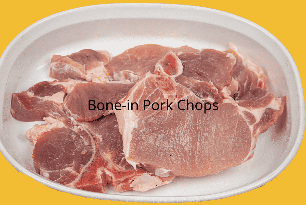 bone-in pork chops on a white platter