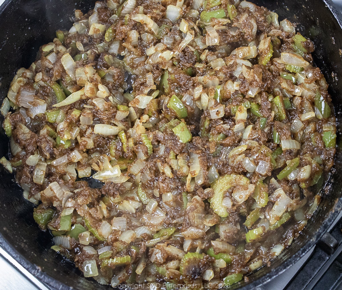 the cajun trinity added to a roux in a dutch oven