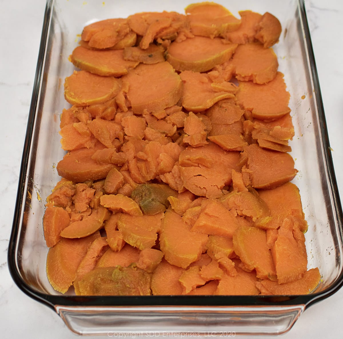 sweet potatoes laid out in a baking dish