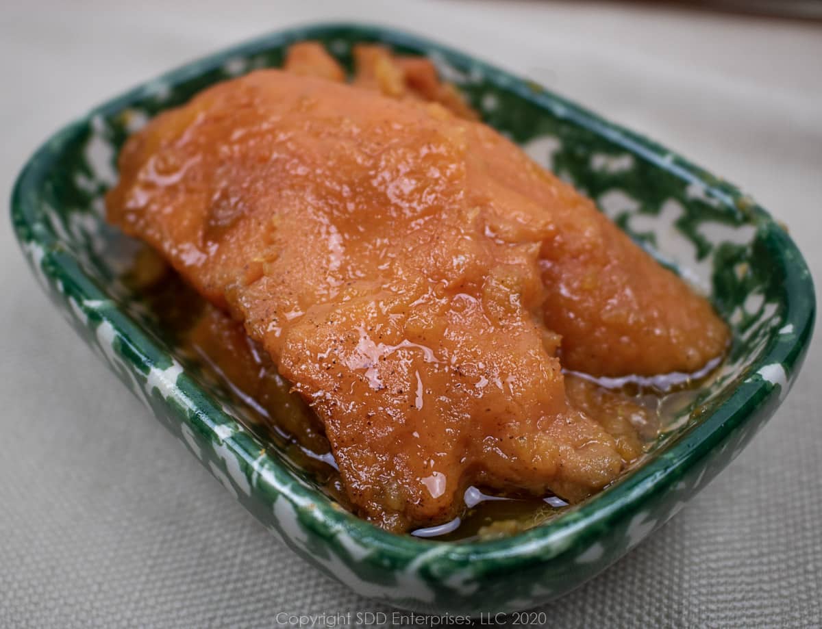 candied yams in a small green bowl