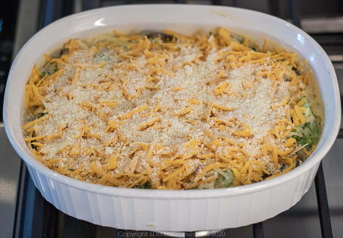 grated cheese place atop broccoli cheese casserole