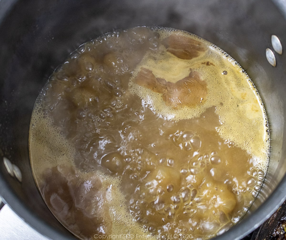 seafood stock simmering on a stockpot