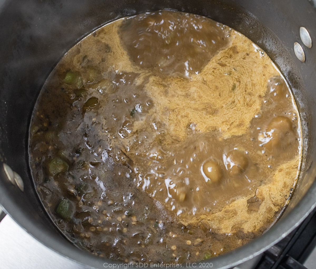 seafood gumbo simmering in a stockpot