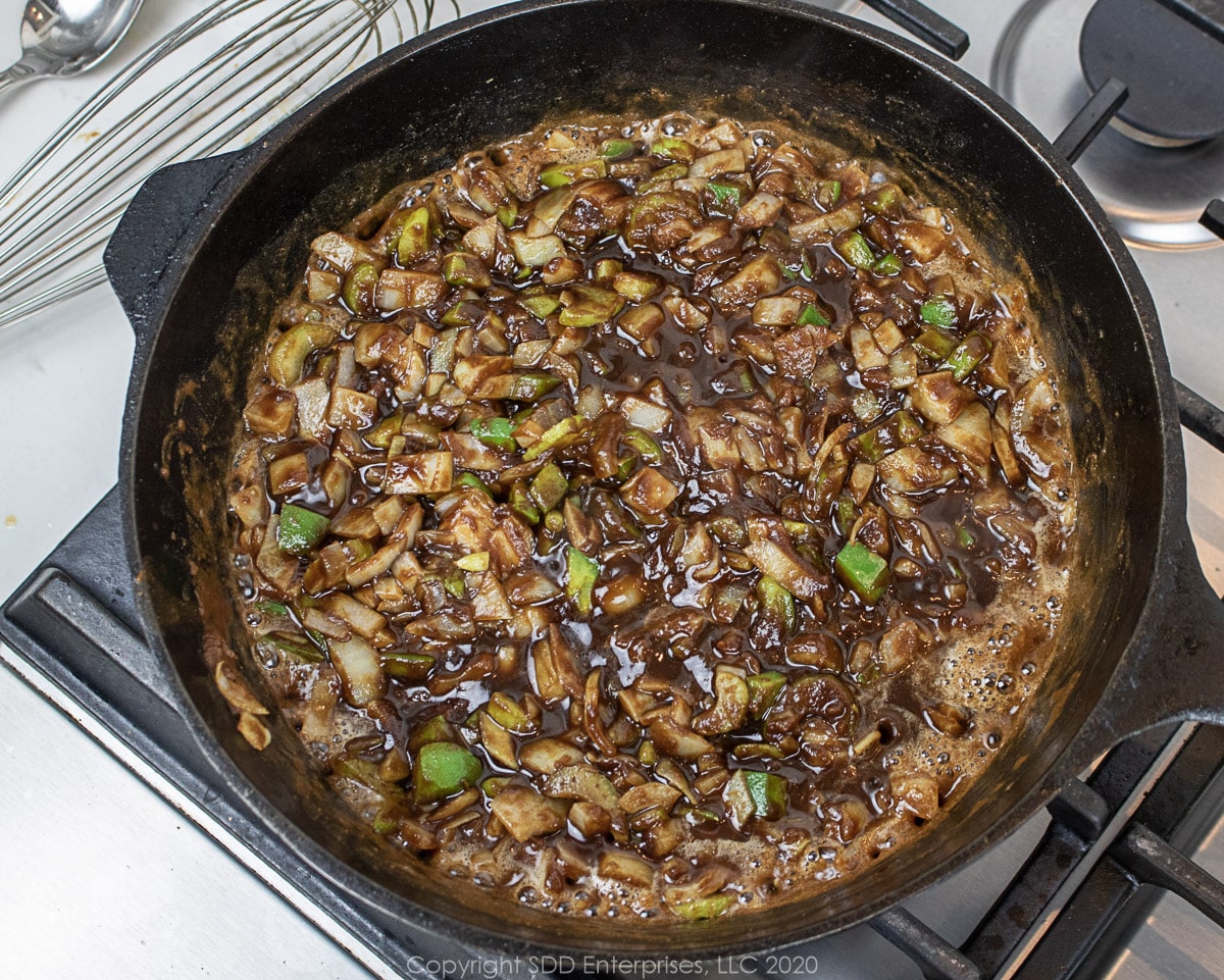 cajun trinity cooked in a roux in a cast iron Dutch oven