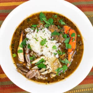 seafood gumbo with rice in a white bowl