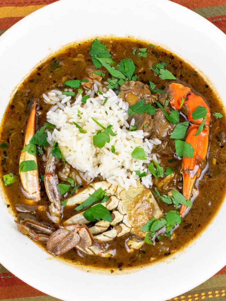 seafood gumbo with rice in a white bowl