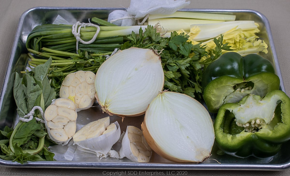 prepped ingredients on a baking sheet for stock