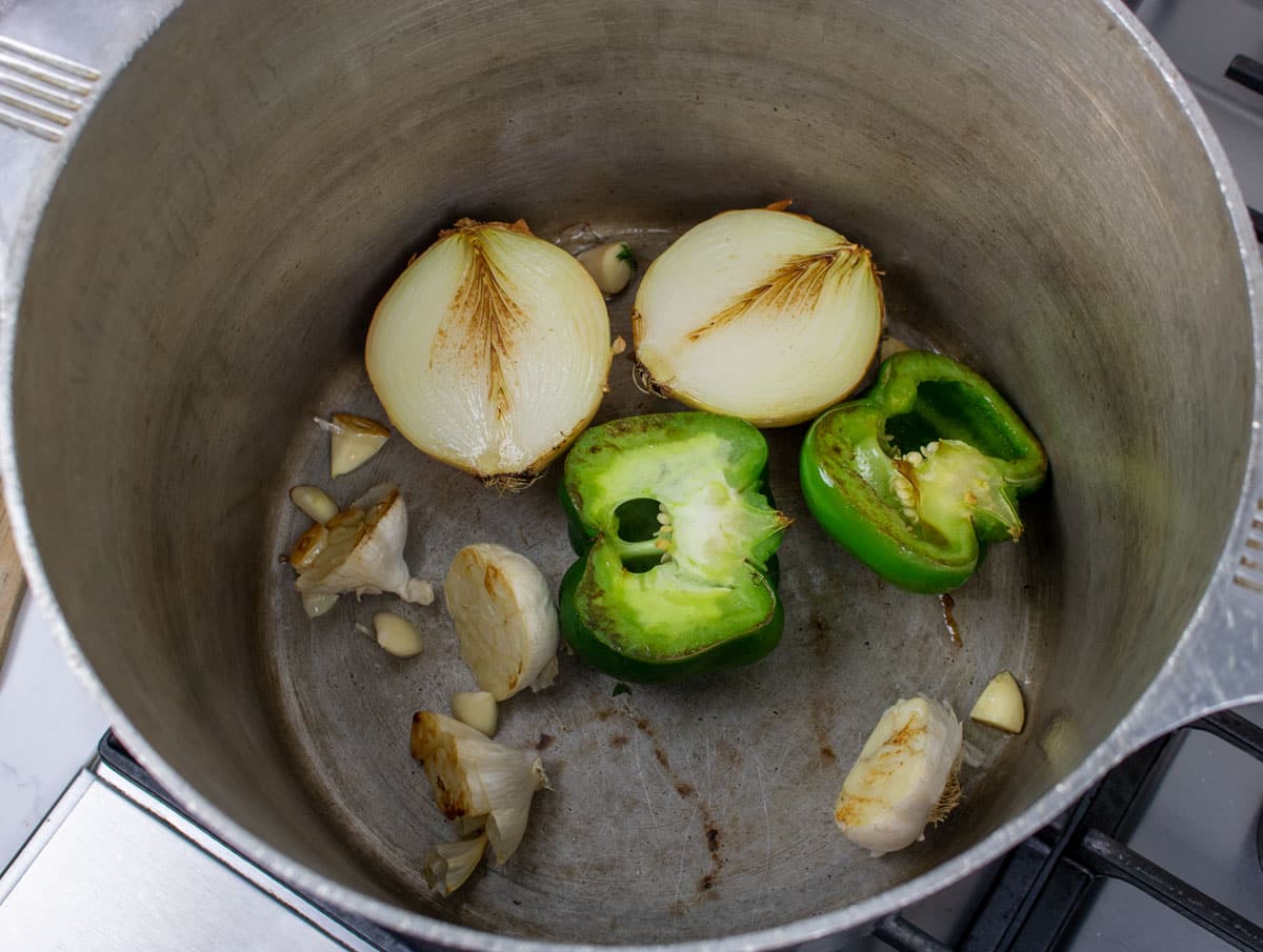 searing onions, bell peppers and garlic in a stockpot