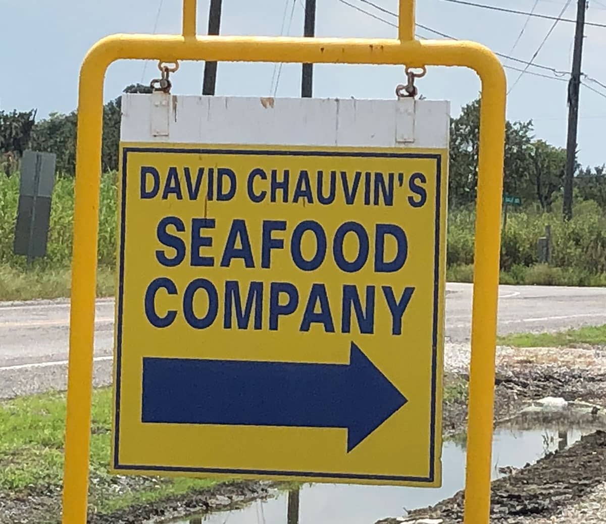 yellow outdoor sign for david chauvin's seafood company