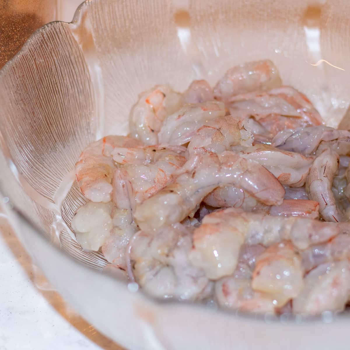 peeled shrimp in a glass bowl