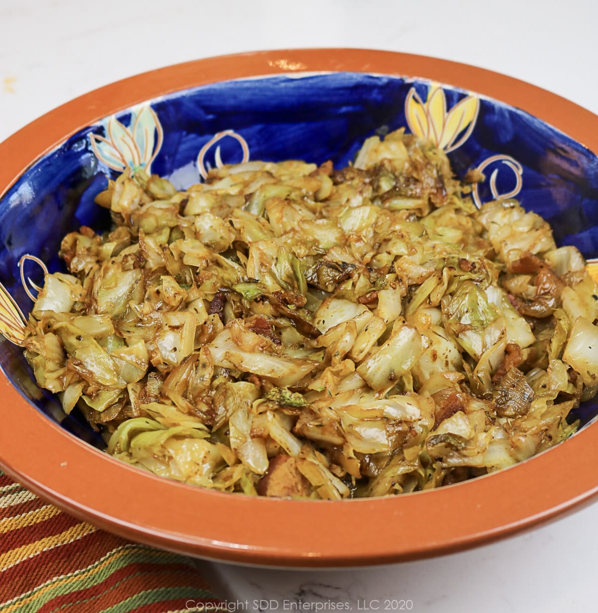 fried cabbage with cane syrup in a decorative bowl