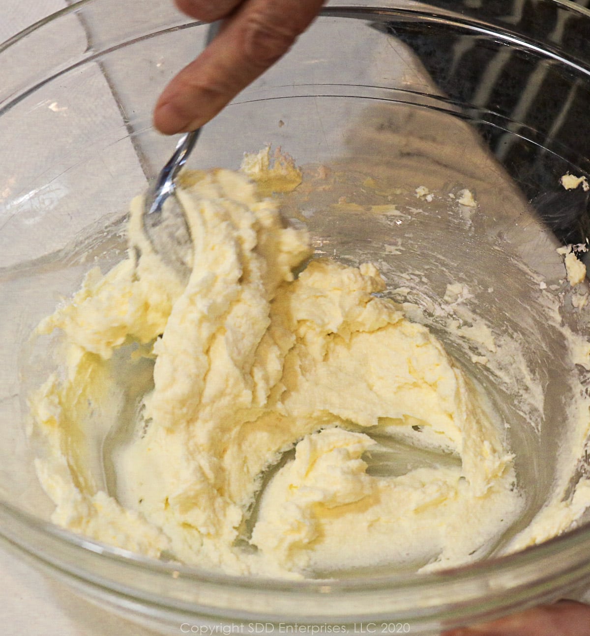 mixing margarine and cream cheese for tart dough