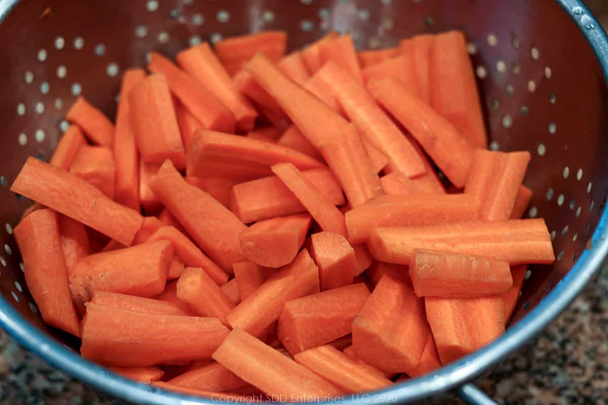 sliced carrots in a colander