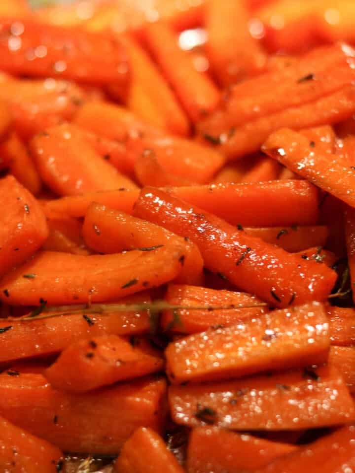 roasted carrots with cane syrup on a baking sheet