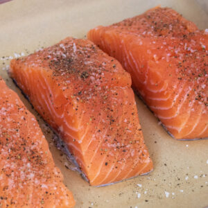 fresh salmon fillets seasoned with salt and pepper