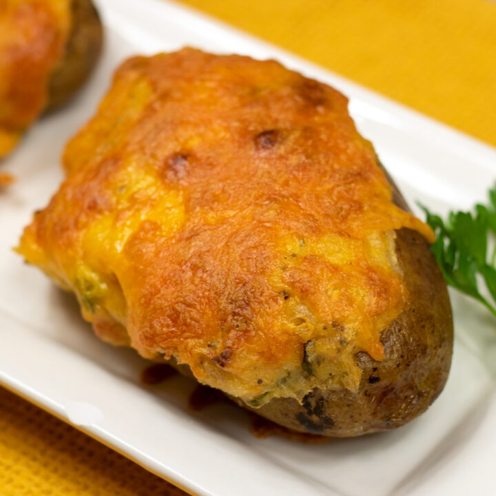 cajun stuffed potatoes on a white serving platter