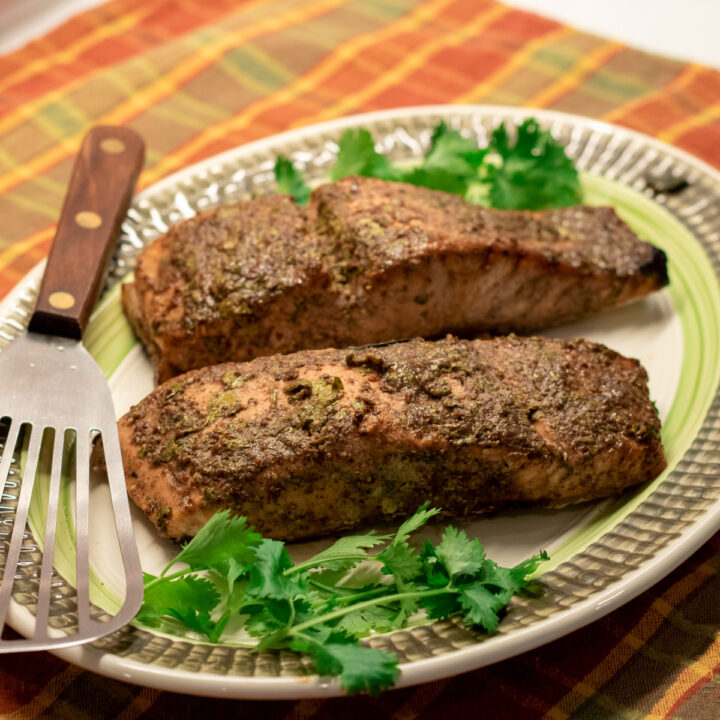 cilantro creole mustard salmon on a serving platter with garnish