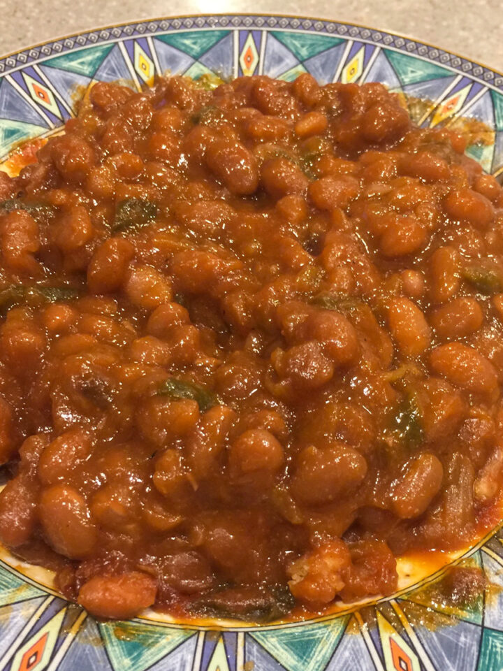 baked beans on a blue-green plate
