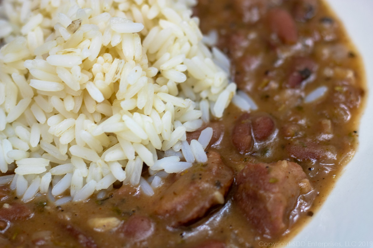 red benas and rice in a white bowl