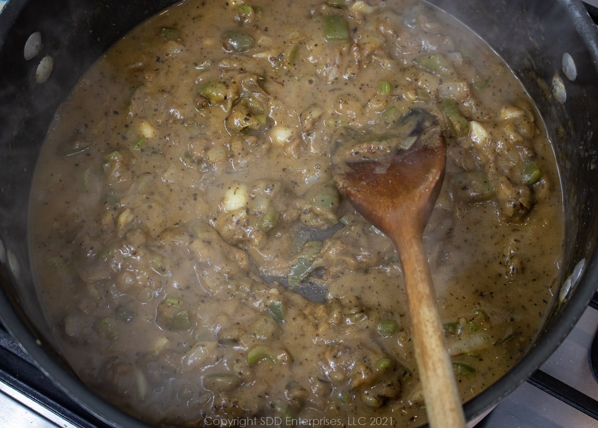 simmering stock in a roux in a Dutch oven