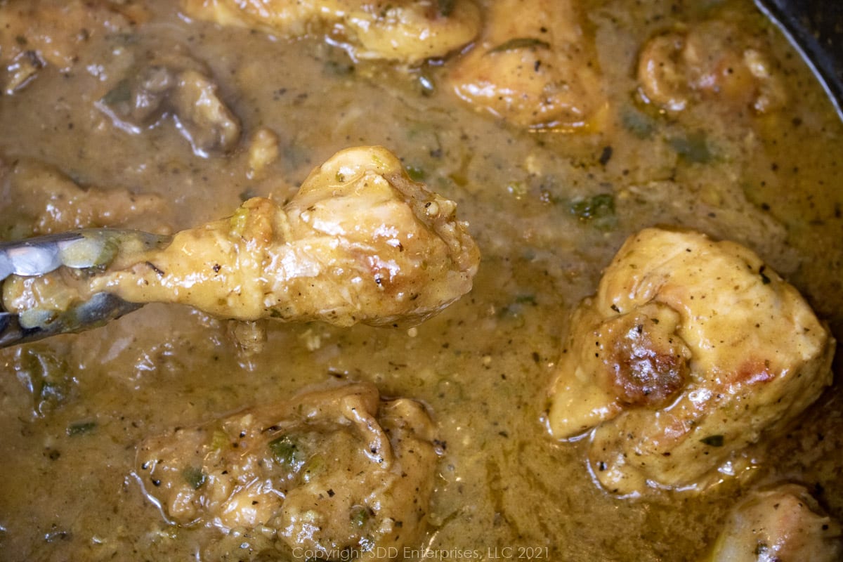 chicken smothered in gravy in a Dutch oven