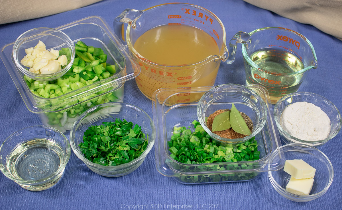 ingredients prepared for smothered chicken in individual prep bowls