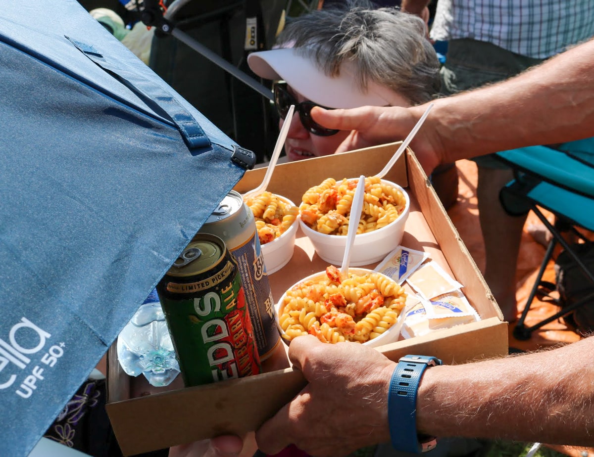 crawfish monica servings in small containers in a box