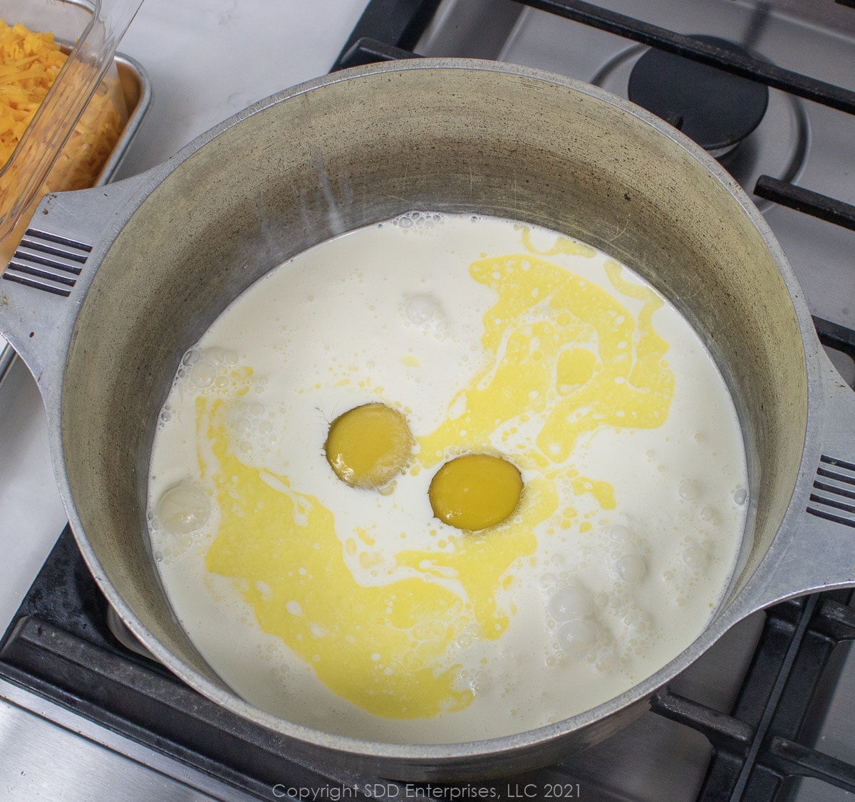 melted butter, eggs and heavy cream in a Dutch oven