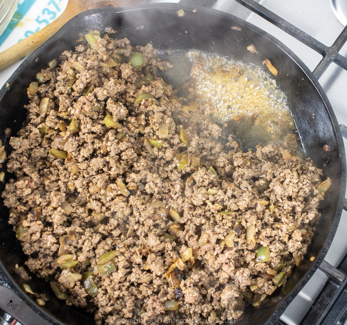 Excess grease from browning ground beef in a cast iron frying pan