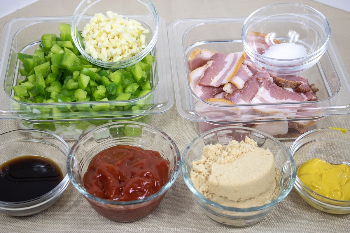 Prepared ingredient for baked beans in pre bowls.