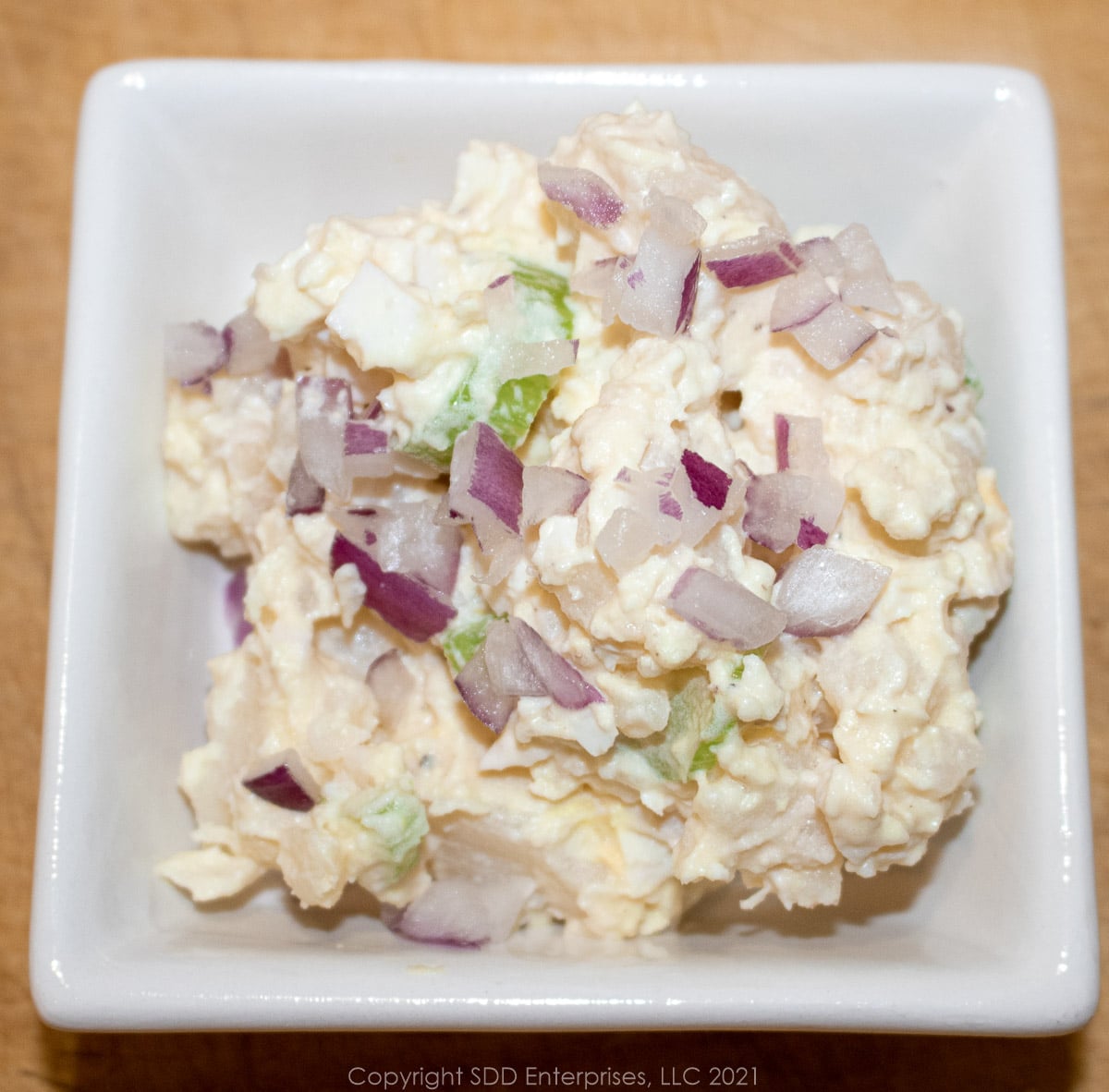 potato salad in a small white bowl