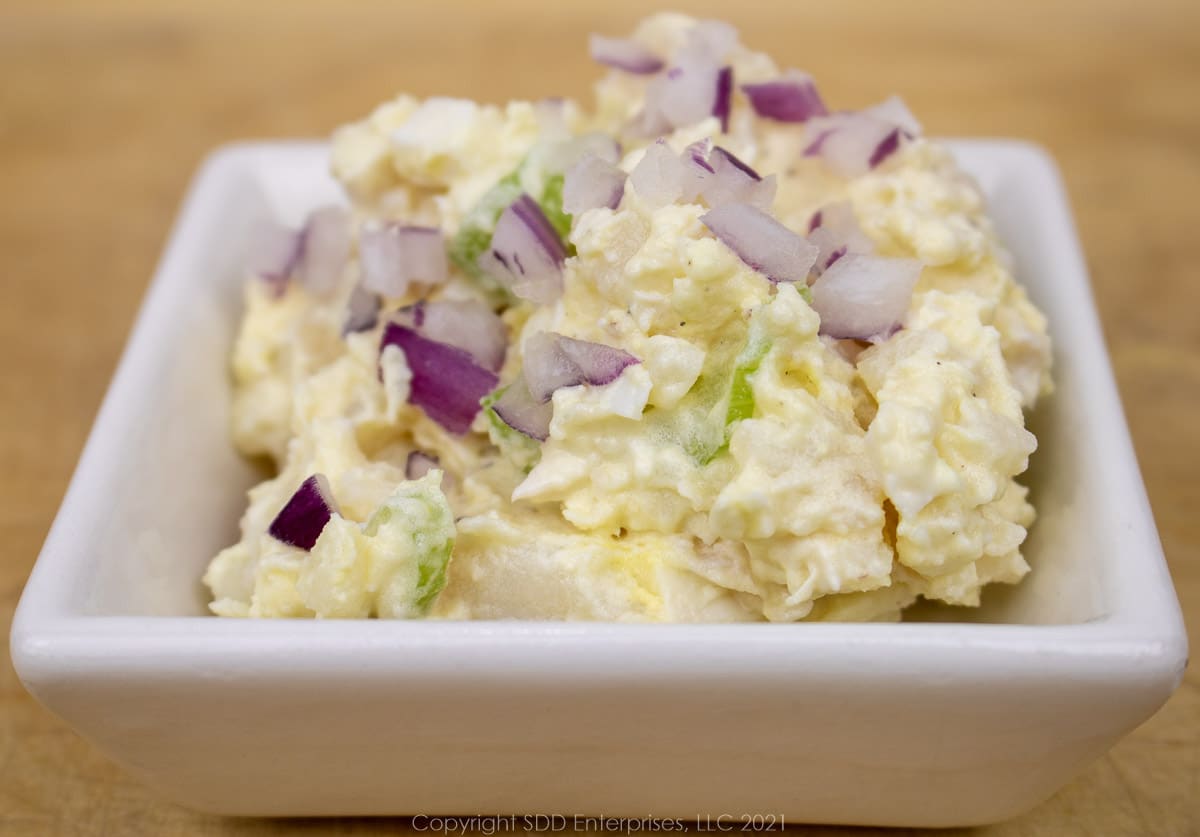 potato salad in a small white bowl