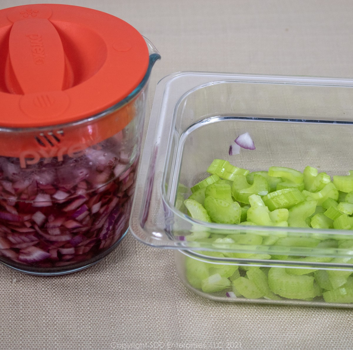 marinating onions and chopped celery in a prep bowl