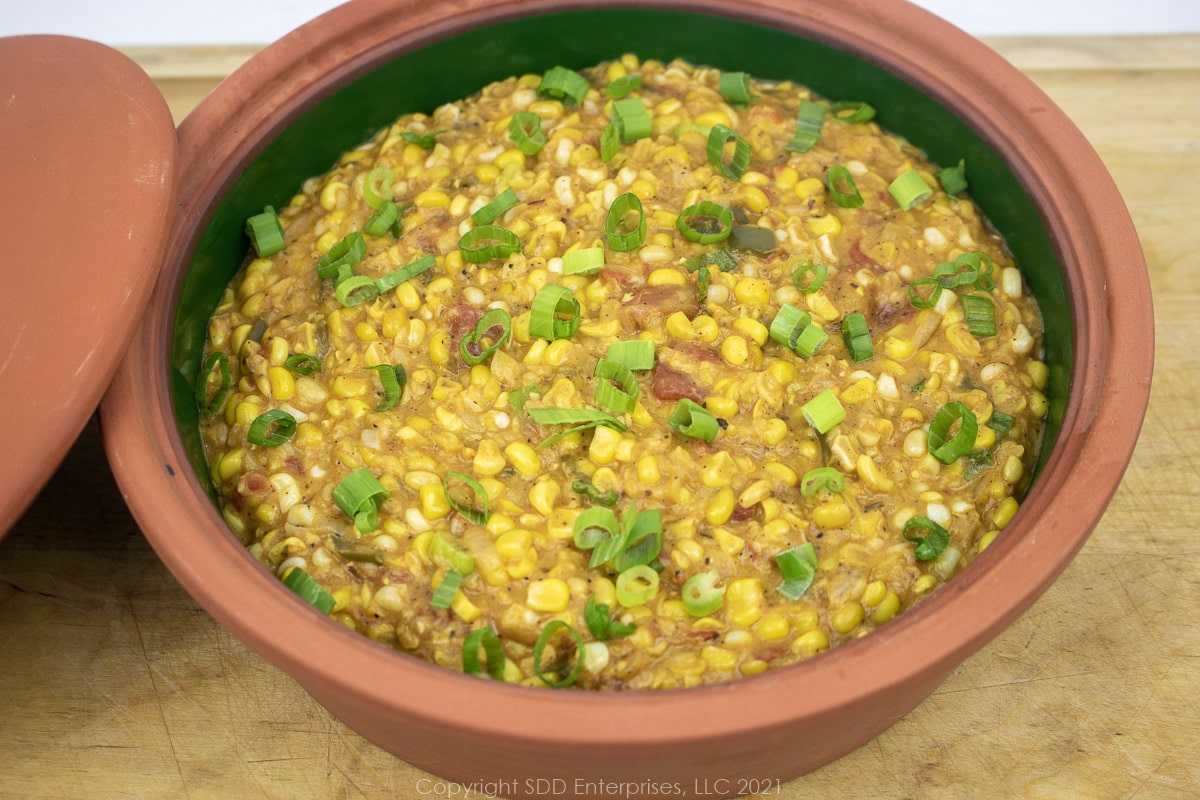 corn maque choux in a brown bowl