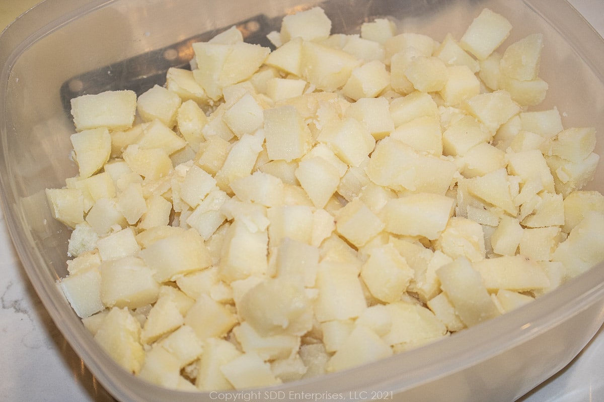 chopped boiled potatoes in a mixing bowl