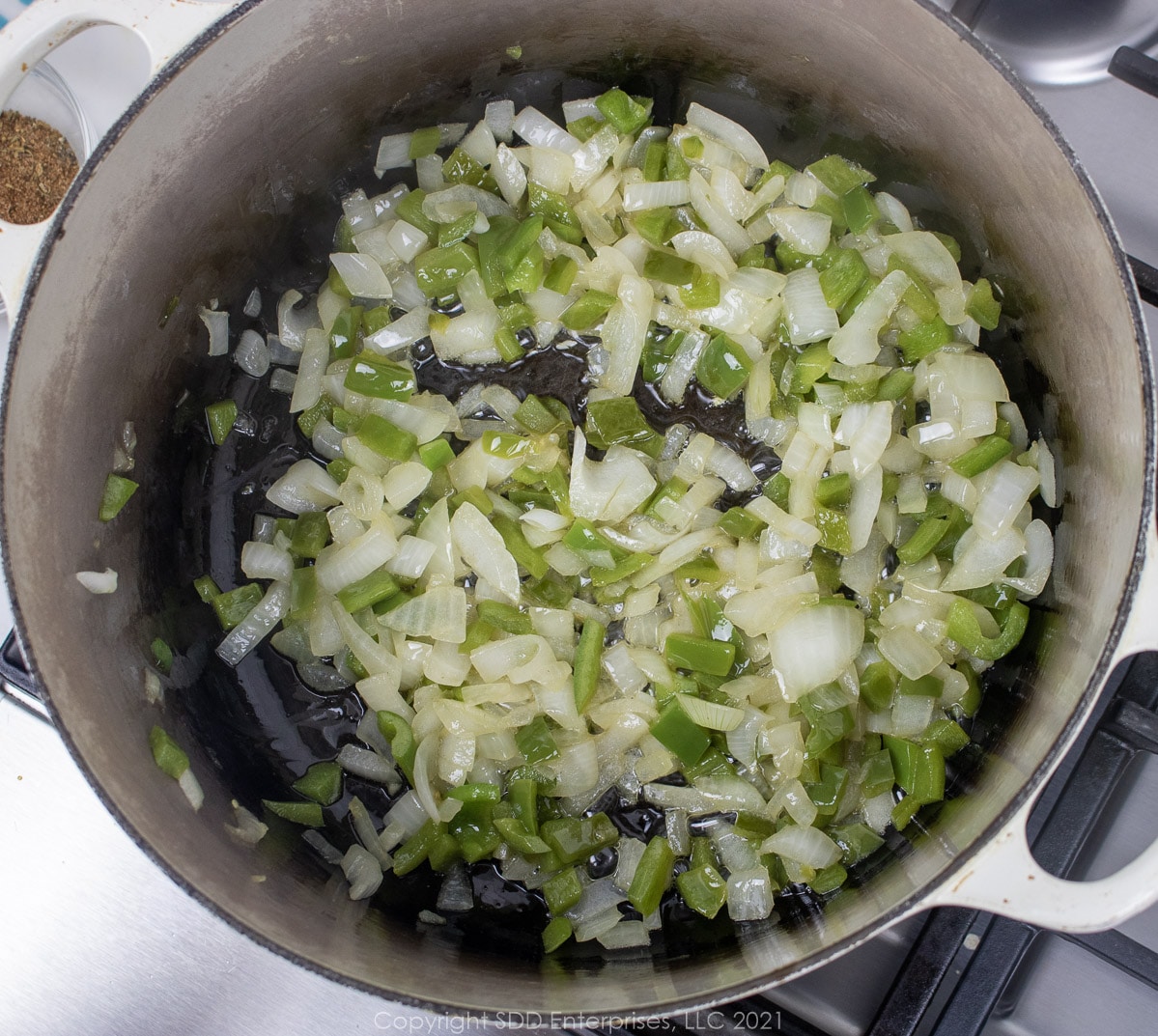 onions, celery and bell pepper in a Dutch oven