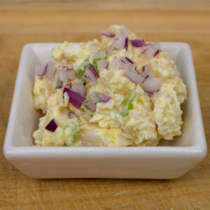 potato salad in a small white bowl