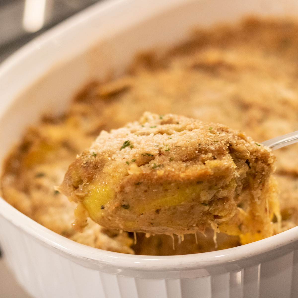 spoon full of yellow squash casserole