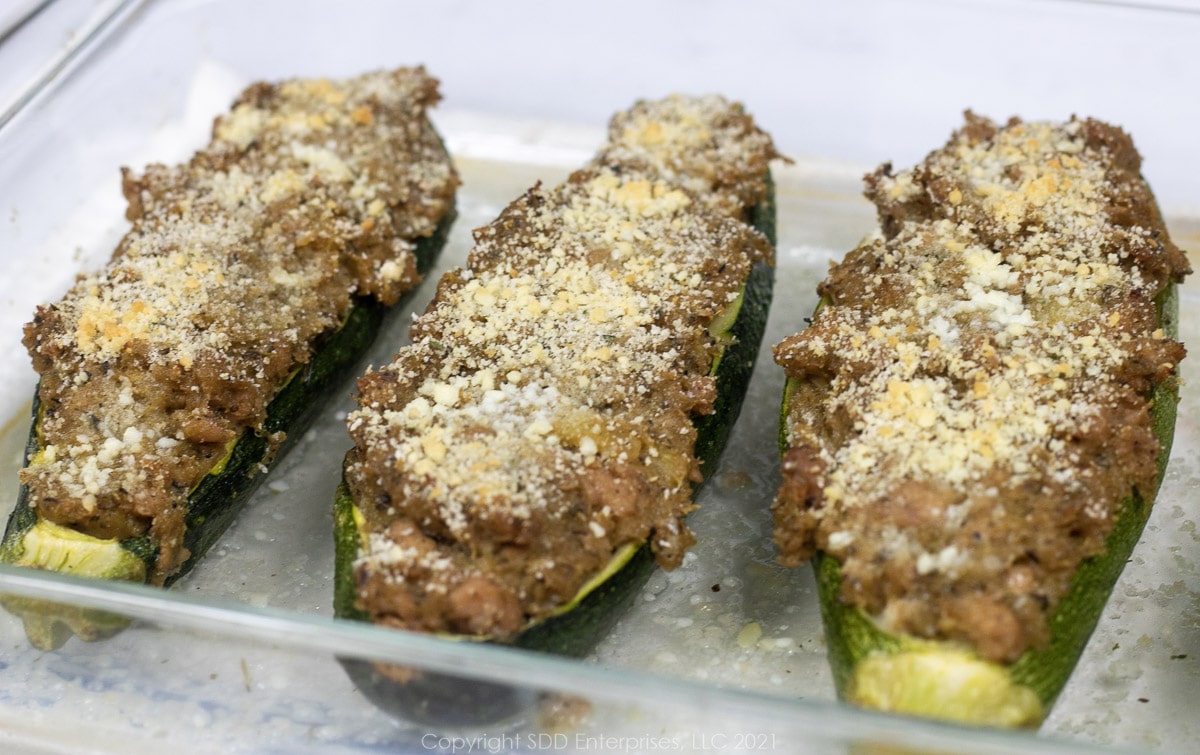 baked stuffed zucchini in a baking dish